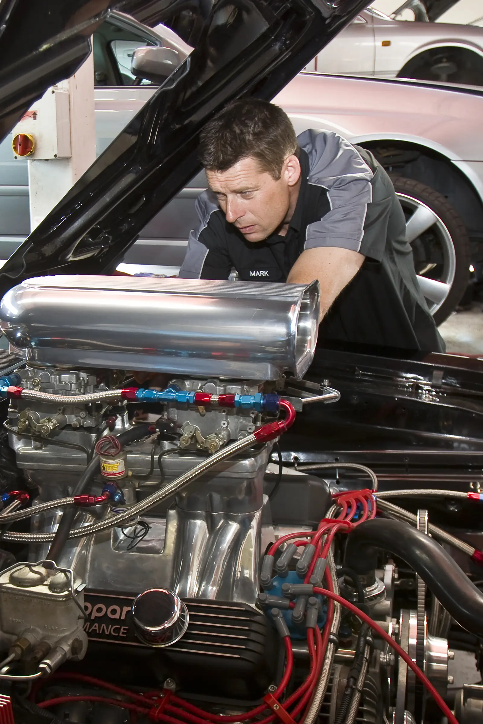 Mark working on a performance engine